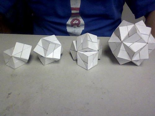 Sonobe Constructs: From the left: conjoined cubes, stellated octahedron, some tetrahedral cube shape, stellated icosahedron