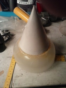 This here is the result of real teamwork. I was walking upstairs and spied a bowl on the shelf. It fit the openings in the giant shell almost perfectly, and had the proper shape for the base of any of Bowser's massive shell-spikes. Affix a posterboard cone, ModPodge it, and soon to be assisted in silicone moulding and casting this ten times by Mr. Daniel Valdez.